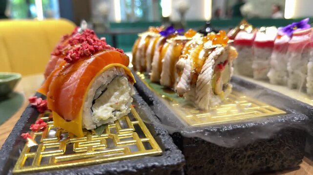 Premium sushi set with salmon tuna eel rolls and dry ice smoke served in luxury Japanese restaurant close up