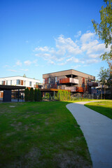Modern contemporary apartment building with secure gated under croft parking. Business-class monolithic house with flats. City apartment in gated community. Suburb apartments in city City suburbs home © MaxSafaniuk
