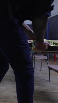 Police investigating a crime in a classroom at school