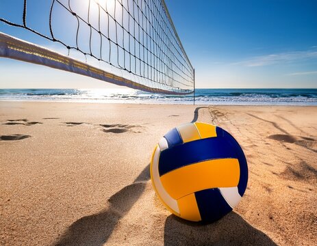beach volleyball ball on sand near net with ocean background