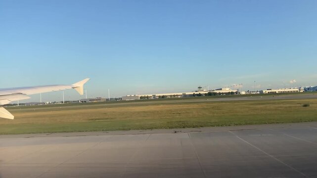 Airplane POV window view taking off from Munich Airport over Bavarian landscape