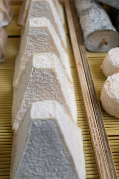 Pouligny-Saint-Pierre AOC goat cheese with its distinctive pyramid shape. Creamy, tangy artisanal French cheese from the Loire Valley with white mold rind, gourmet delicacy, France