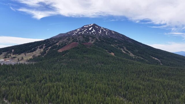 Mt. Bachelor and its many ski trails rise from the Deschutes National Forest in Oregon. This iconic volcanic mountain is part of the Cascade Range and just 22 miles from Bend.