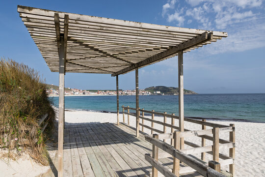 Wooden pergola offering shade on laxe beach, galicia, spain