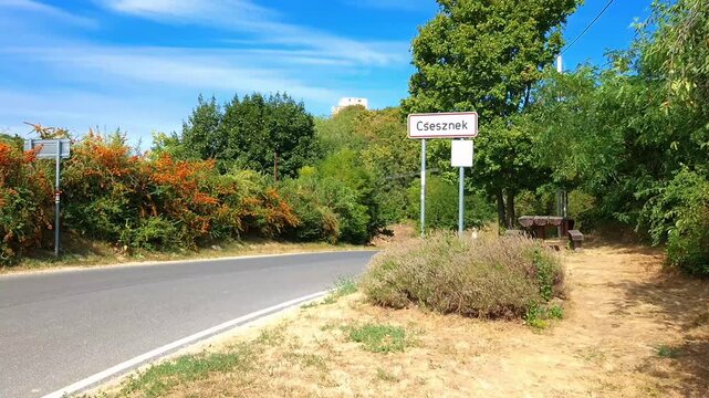 CSESZNEK, HUNGARY - AUGUST 7. 2024: The village sign of Csesznek and The Castle of Csesznek in Hungary
