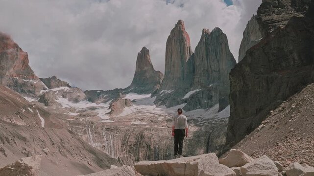 Female hiker standing at Mirador Las Torres in Torres del Paine National Park, Patagonia, Chile