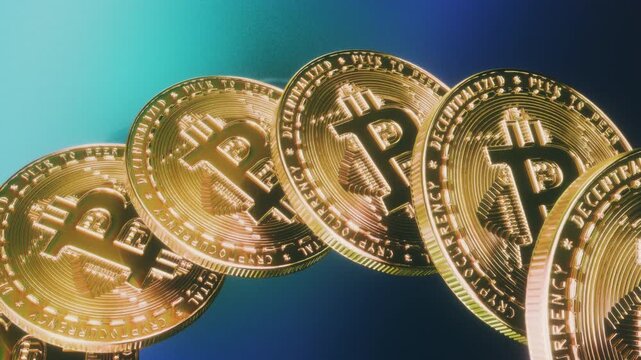 Golden bitcoin coins tilted in a row with peer to peer decentralized text on blue background as a seamless loop ideal for crypto trading apps or financial broadcast graphics