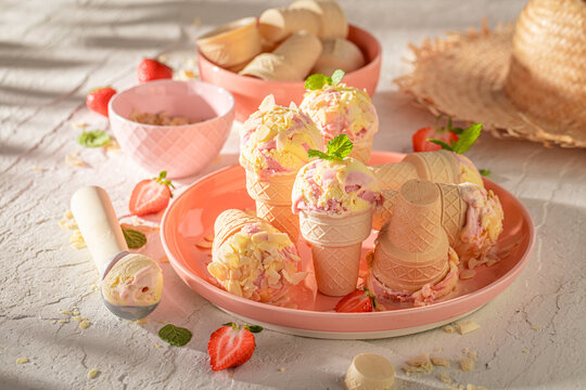 Homemade and juicy strawberry ice cream for hot summer day.