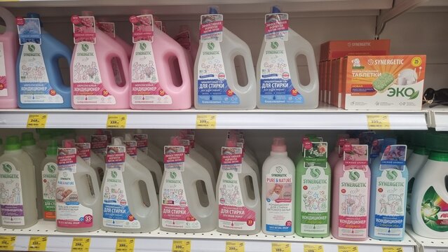 Eco-friendly laundry detergents and fabric softeners on supermarket shelves