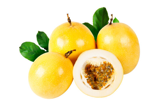 Fresh yellow passion fruits with one sliced fruit displaying natural pulp and seeds, arranged with vibrant green leaves and isolated on a white background