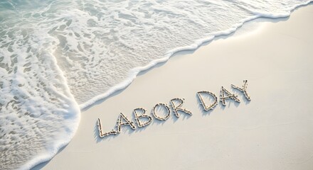 Labor Day text written in beach sand