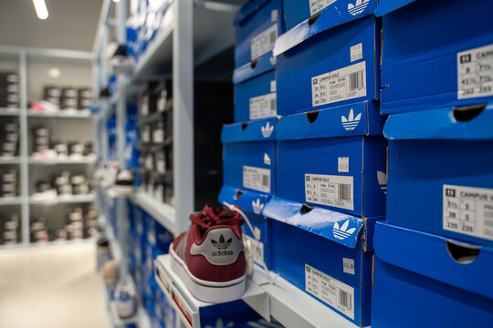 Adidas shoe boxes displayed inside outlet store. Toronto, Canada - July 13, 2026.