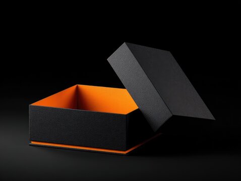 An open black box with an orange interior. The lid is ajar, showing the bright color inside. The background is black