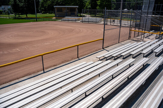 Empty baseball diamond viewed from stadium bleachers.
