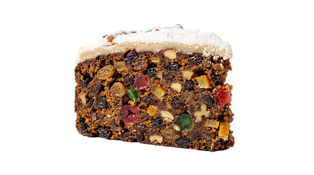 Slice of traditional Christmas fruitcake with rich dried fruits nuts and marzipan icing