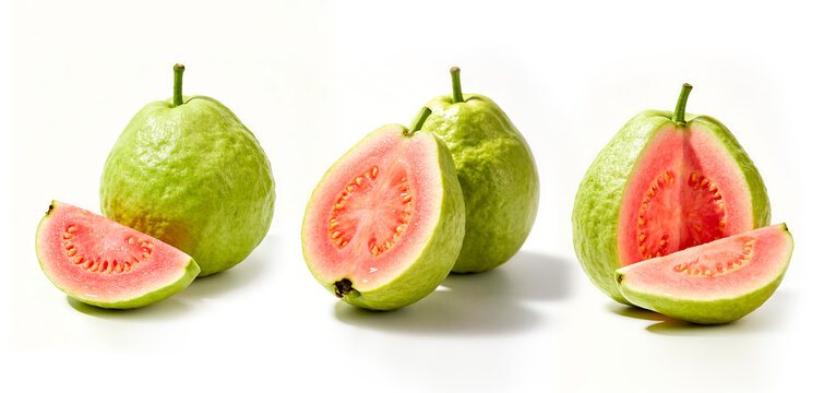 Three sets of whole and sliced pink guava on white background