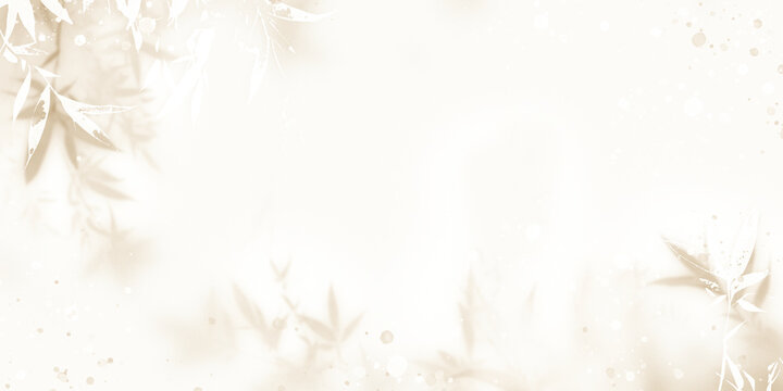 A soft light beige background with blurred leaves and empty space in the middle.