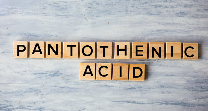 Pantothenic Acid Concept Spelled with Wooden Blocks on Marble Surface