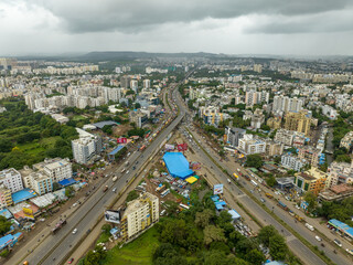 Fototapeta premium Aerial view of expressway interchange and urban landscape in Pune 