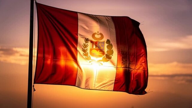National flag of peru waving against a golden sunset sky