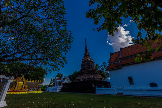 The natural background of the evening twilight, the colorful sky inside Sukhothai Historical Park, a tourist attraction that Europeans always visit.