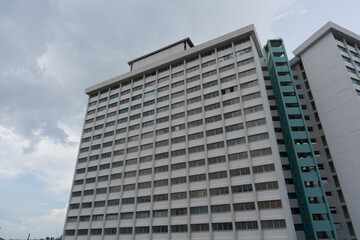 Fototapeta premium Tall building with many windows and balconies