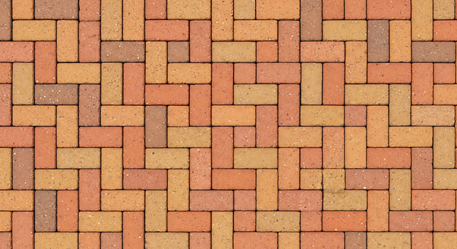 Decorative paving brick pattern with grainy texture on an outdoor pavement for urban walkways