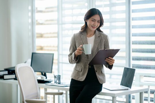 Professional woman focusing on important document at office work environment