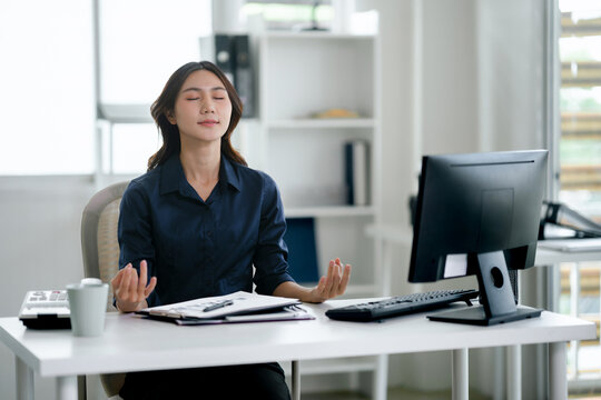 woman meditation at workplace, calming mind