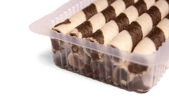 Chocolate wafer rolls with chocolate cream filling isolated on white background