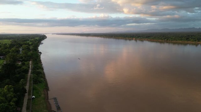 Aerial view landscape of the Mekong river in Nakhon Panom, Thailand.Scene of residential development, waterway transport, and agricultural economy in Thailand.