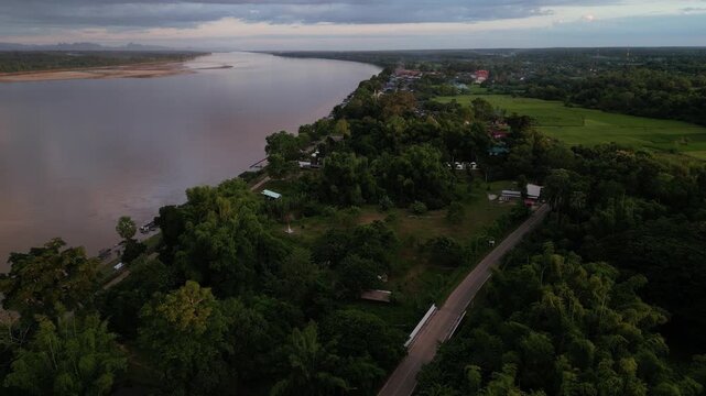 Aerial view landscape of the Mekong river in Nakhon Panom, Thailand.Scene of residential development, waterway transport, and agricultural economy in Thailand.
