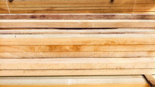 Wood or wood texture 2 inches by two inches and 1 inch by two inches. Wood stack Stacked together Nature cut into pieces for decorating work or Structure. wood material industrial background