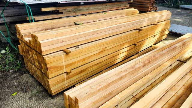 Wood or wood texture 2 inches by two inches and 1 inch by two inches. Wood stack Stacked together Nature cut into pieces for decorating work or Structure. wood material industrial background