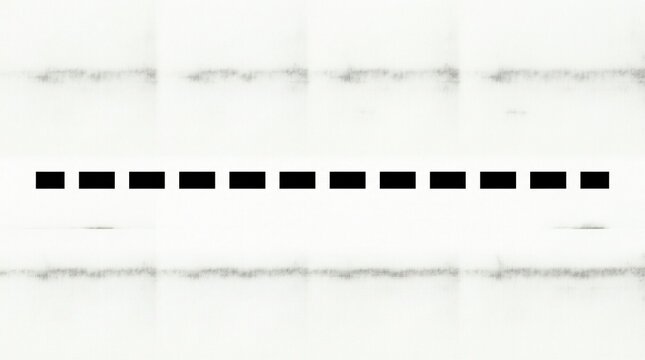 Black dashed line on a textured paper surface