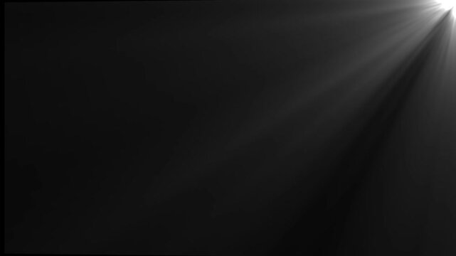 Dramatic volumetric white light rays shining from top right corner on a dark black background loop.