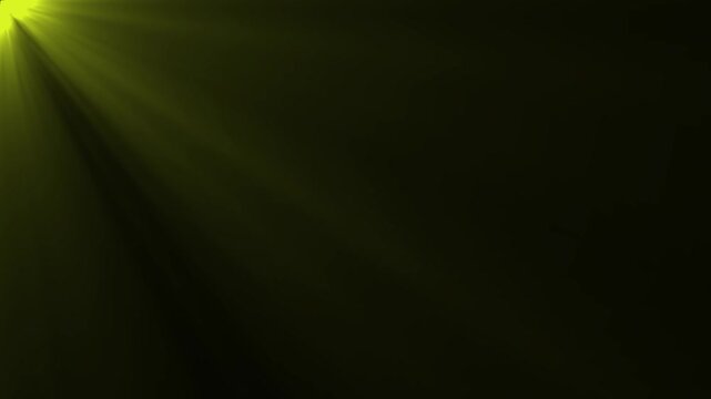 Bright yellow green light rays streaming from top left corner on a black background for tech or nature concept video.