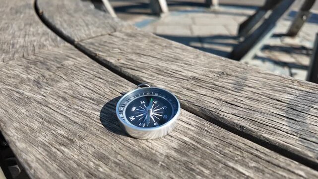 Compass on Wooden Bench for Hiking Navigation