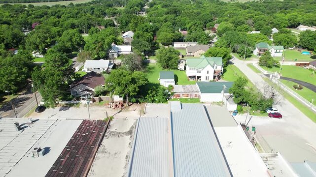 Aerial video of the town of St Jo in Texas. Camera is flying south from the town square.