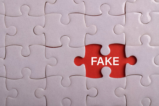 White jigsaw puzzle with a highlighted fake piece on a red background, representing misinformation, fraud, deception, counterfeit products, false claims, and trust issues.