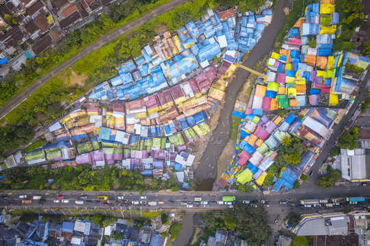 Aerial view of the colorful Rainbow Village in Malang, Indonesia, showcasing vibrant rooftops and urban layout