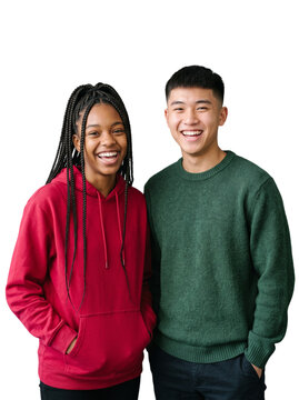 Cheerful diverse teenage friends laughing in hoodies