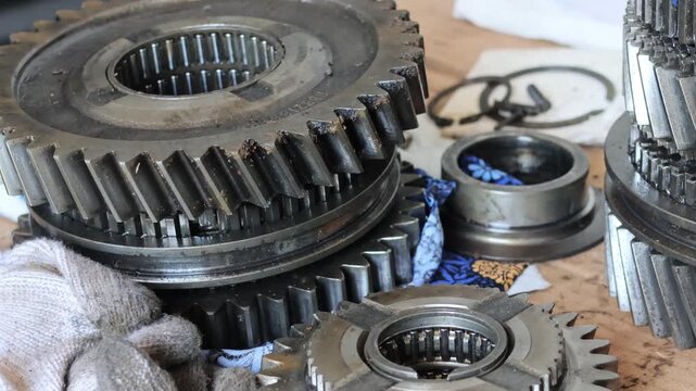 Close up shot of mechanical helical gears and splined shaft from a transmission system.