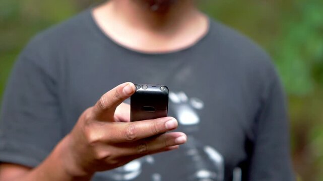Using a mobile phone in the 2000s. One type of vintage mobile phone.