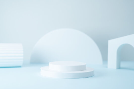 Minimalist Product Display Podium with Geometric Shapes on Light Blue Background