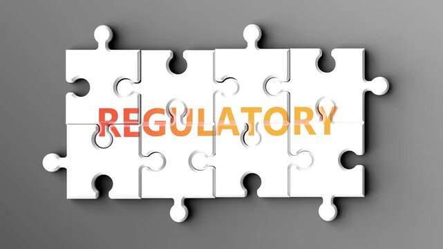 Regulatory being a complex topic - puzzle pieces with word regulatory coming together to make a whole. Regulatory made of many fitting parts, a compound subject.