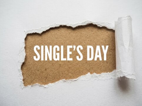 Torn Paper Revealing "Single's Day" Text, Retail Sale Concept