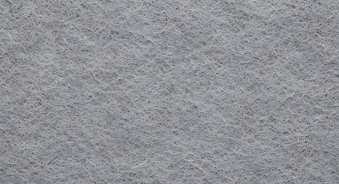 Detailed texture of fibrous grey material and synthetic wool fibers in a soft fabric background