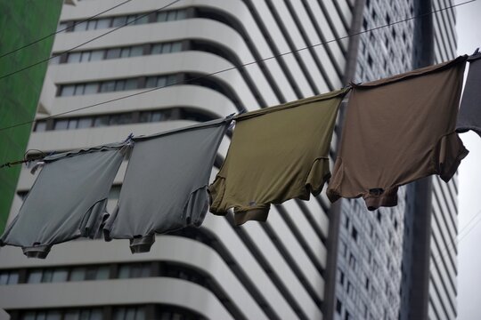  Urban contrast in Batumi with laundry drying against modern skyscraper backdrop