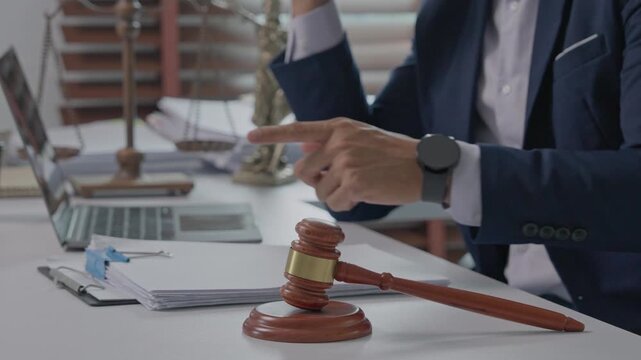 Male lawyer working on legal documents in his office